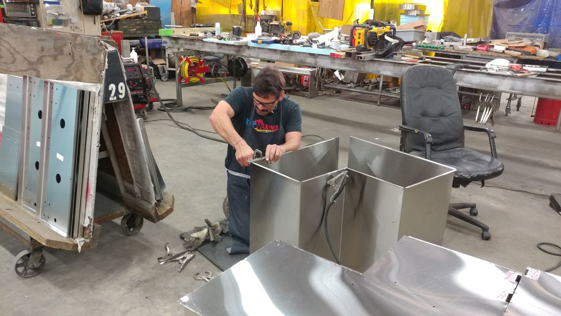 man working on stainless steel